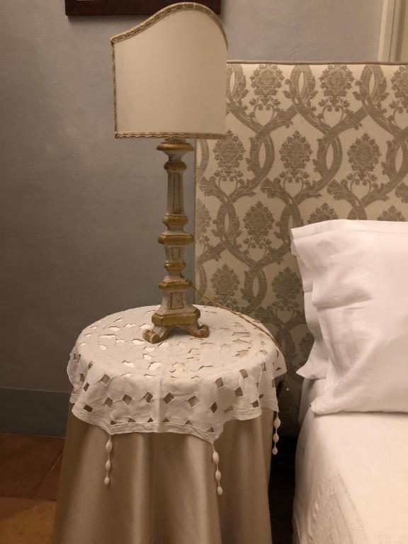 Postel nebo postele na pokoji v ubytování Le Case Di San Vitale