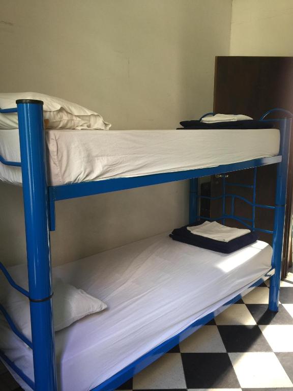 Postel nebo postele na pokoji v ubytování Rivera Hostel Córdoba