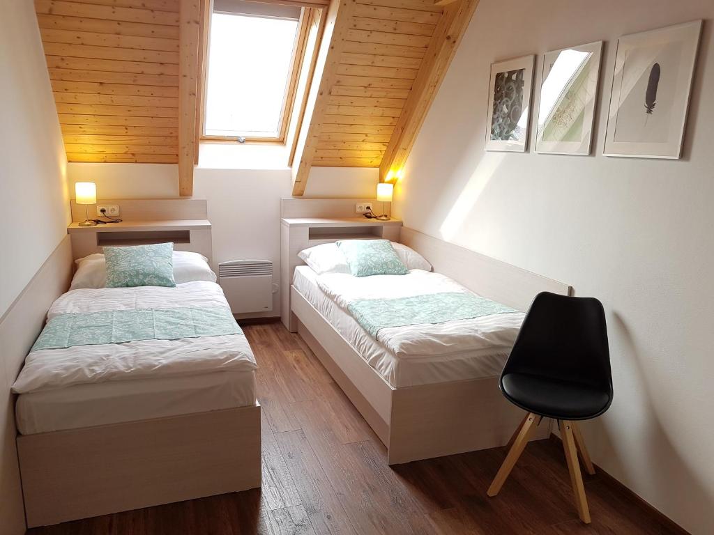 Katil atau katil-katil dalam bilik di Apartmán NIKI Apollon Resort Lednice