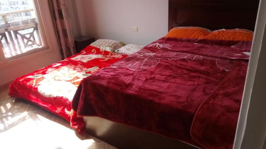 A bed or beds in a room at Mohamed Afifi Florence El Montazah - 2 Bed rooms - "Compound"