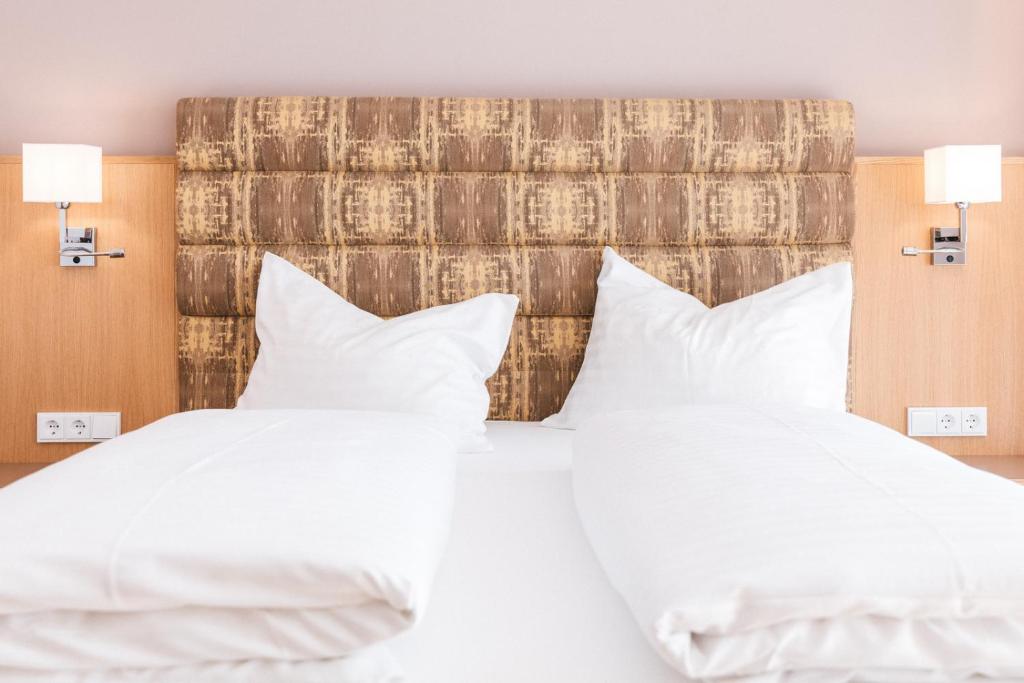 Voodi või voodid majutusasutuse Hotel am Marktplatz - Landgasthof Wratschko - Gamlitz toas