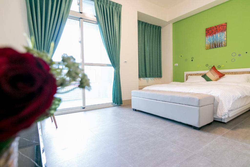 Postel nebo postele na pokoji v ubytování Ruisui Style B&B