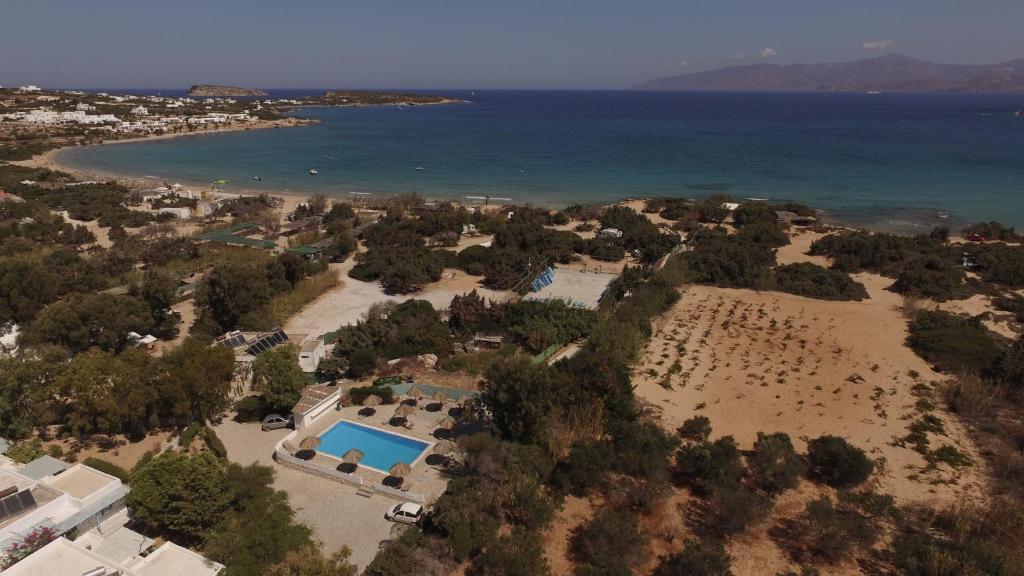an aerial view of a beach with a swimming pool at Surfing Beach Village Paros in Santa Maria