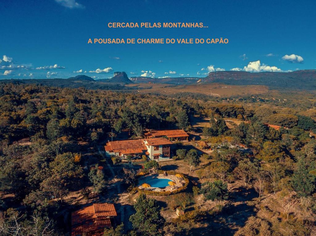 a panoramic view of a villa in the mountains at Pousada Villa Lagoa das Cores in Vale do Capao