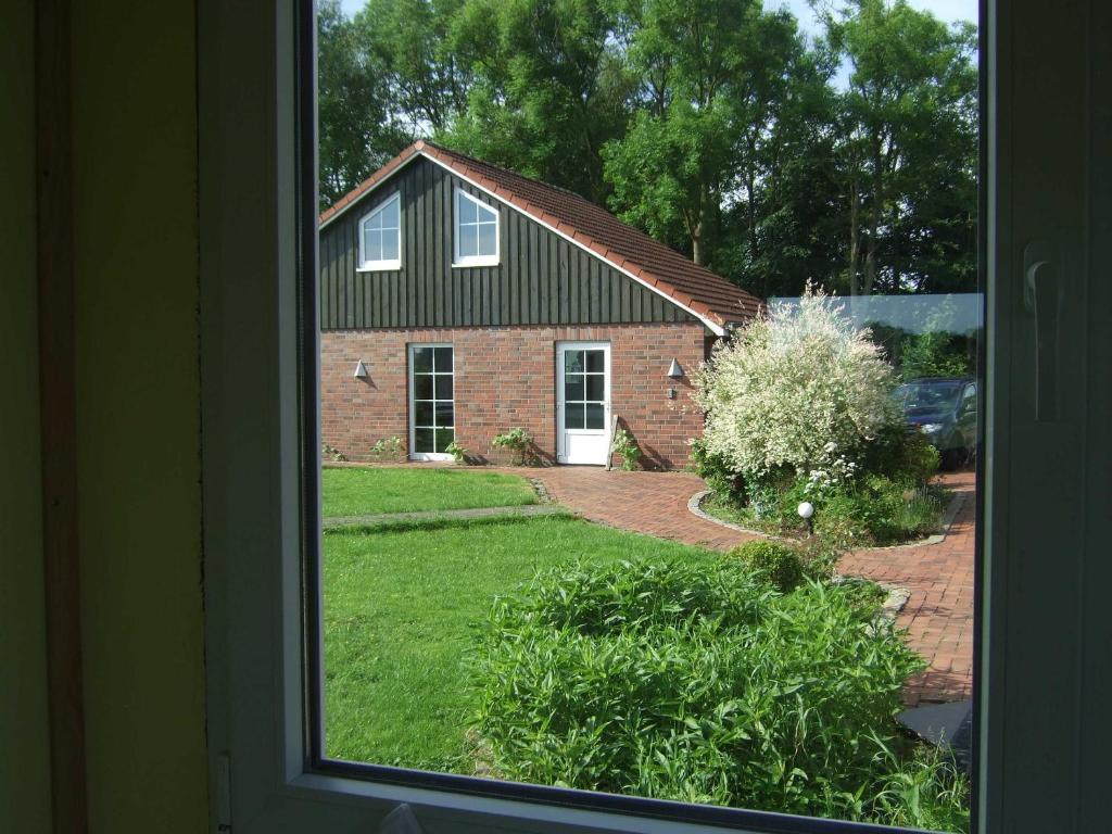 a view of a brick house from a window at Luxus Chalet mit Terrasse, sehr ruhig in Kollmar in Kollmar