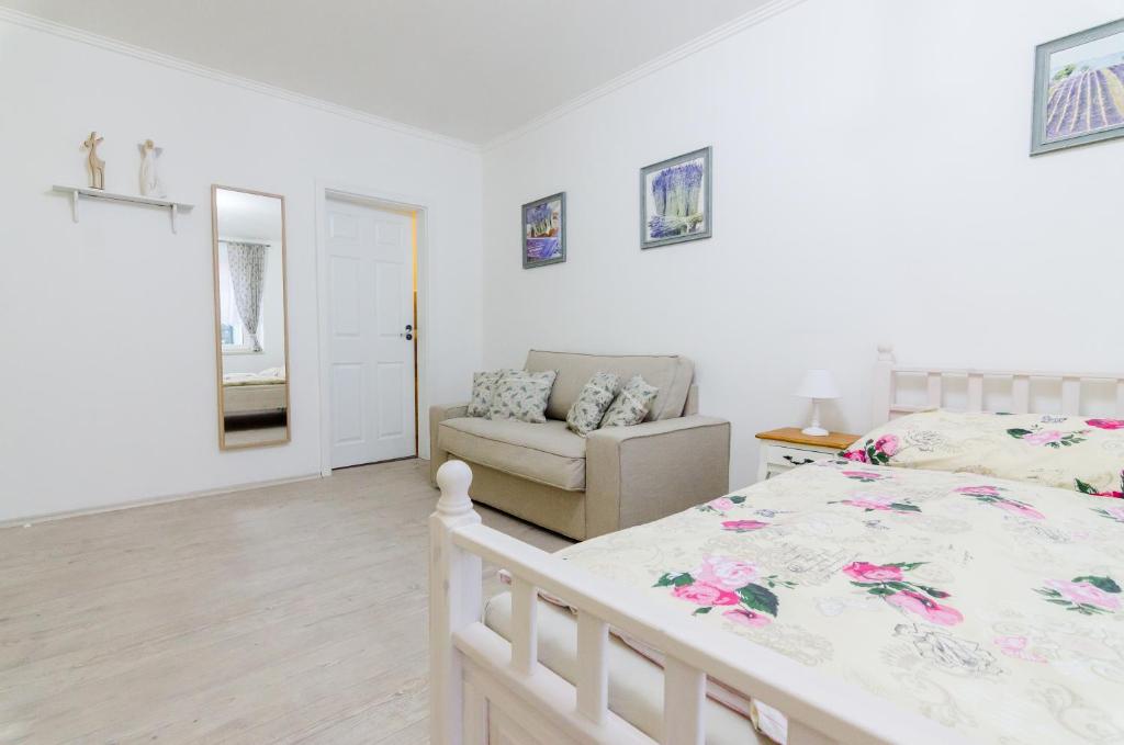 Postel nebo postele na pokoji v ubytování Guesthouse SaM