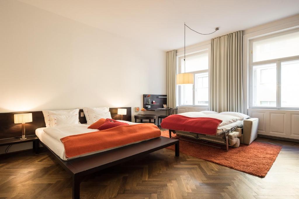 Postel nebo postele na pokoji v ubytování Hollmann Beletage Design & Boutique Hotel