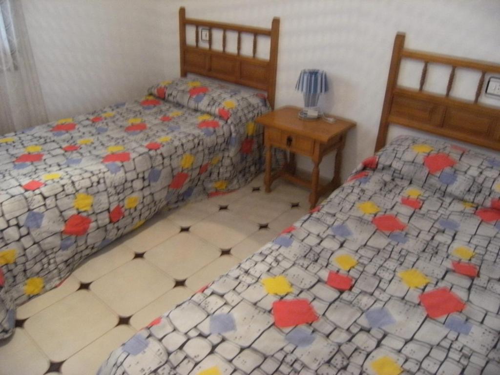Posteľ alebo postele v izbe v ubytovaní Casa la Flor