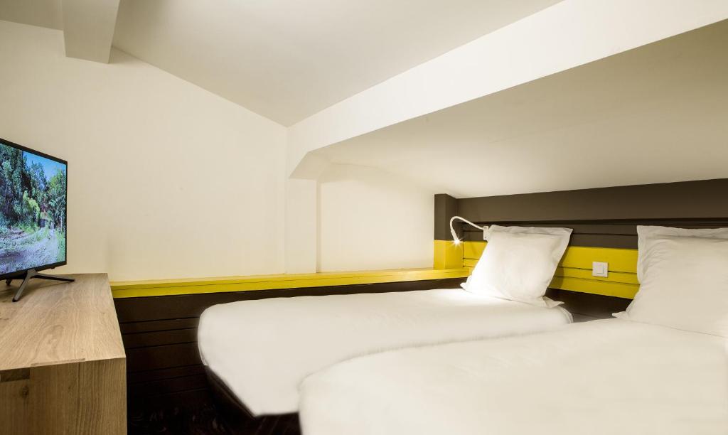 Postel nebo postele na pokoji v ubytování Hotel Ormelune
