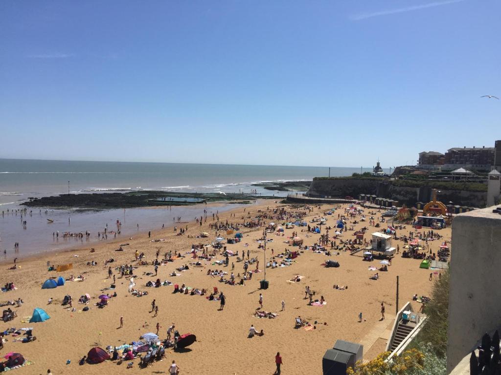a large group of people on a beach at Seaview Cottage in Broadstairs