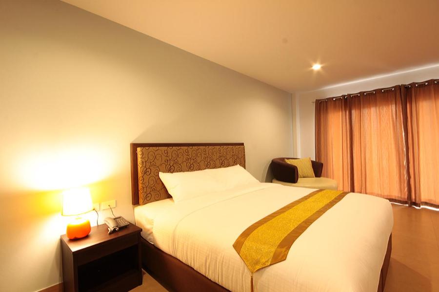 Postel nebo postele na pokoji v ubytování Paragon Suites Resort
