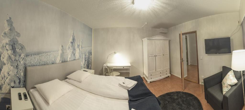 Postel nebo postele na pokoji v ubytování Hotel Kittilä