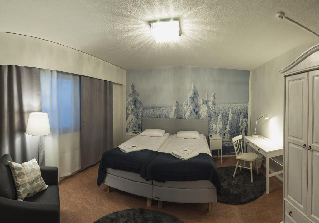 Postel nebo postele na pokoji v ubytování Hotel Kittilä