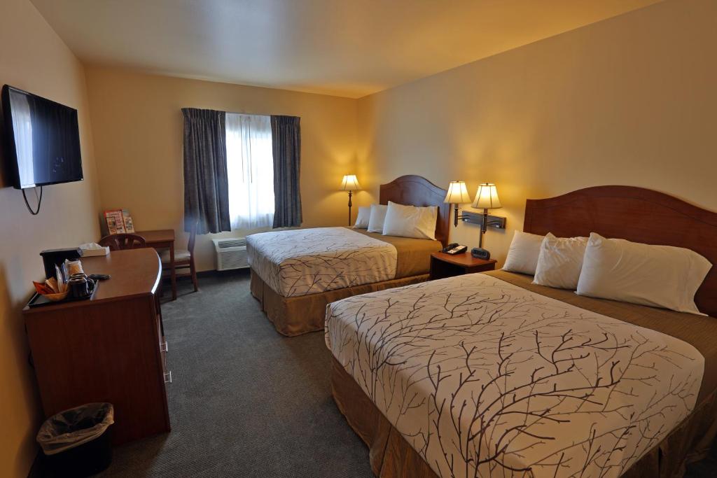 Katil atau katil-katil dalam bilik di Sandhills Guest House Motel