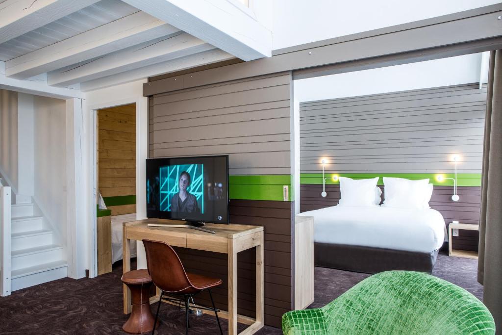 TV a/nebo společenská místnost v ubytování Hotel Ormelune