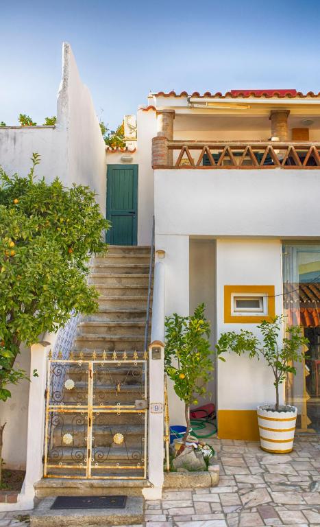 a set of stairs leading to a house at Casa Vitória Guest House in Évora