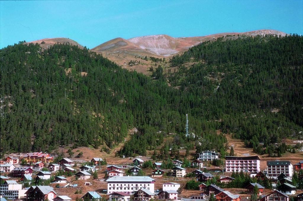 a small town in front of a mountain at VTF Le Grand Hotel in Montgenèvre