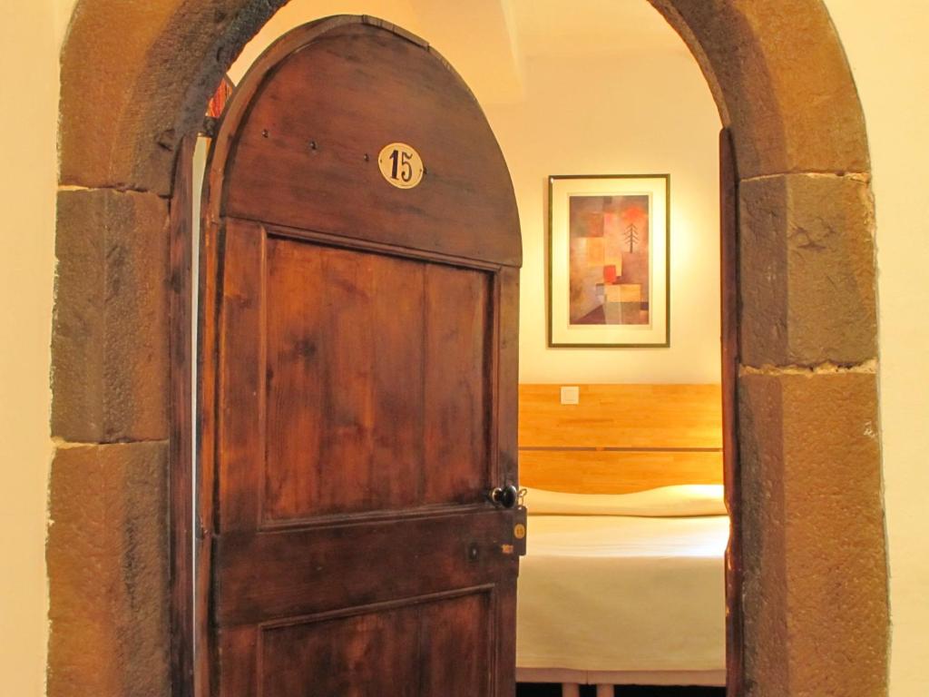 Postel nebo postele na pokoji v ubytování L'Auberge du Cèdre