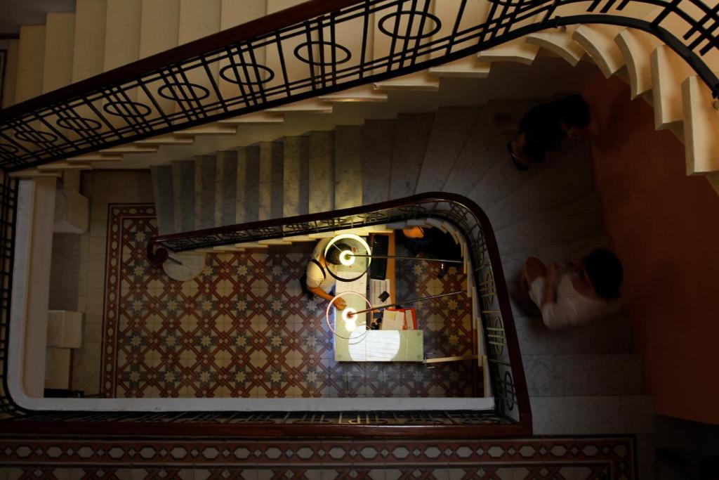 a view of a doll house through a mirror at Corner Hostel in Sliema