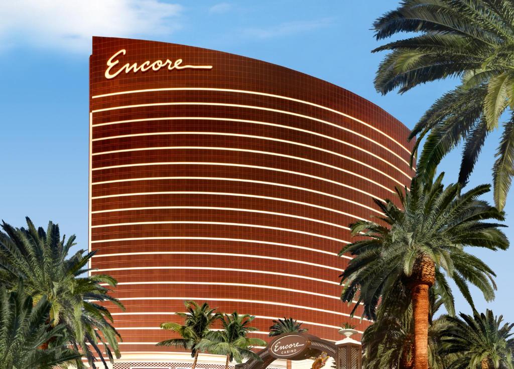 a large palm tree in front of a large building at Encore at Wynn Las Vegas in Las Vegas
