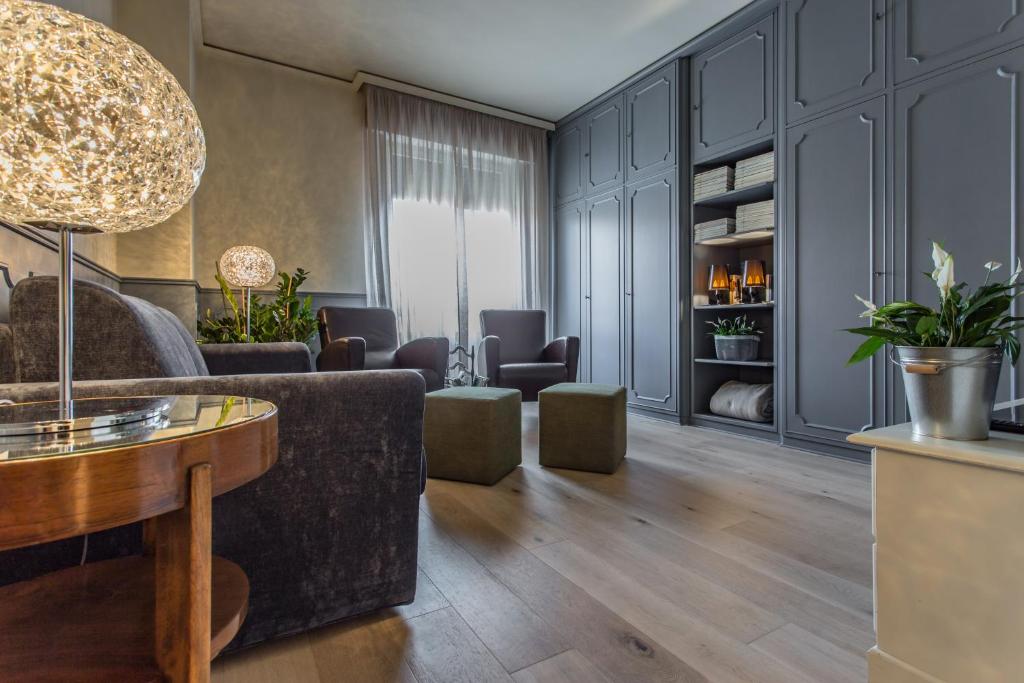 a living room with a couch and a table at Spazio Duomo1 by Welc(H)ome in Treviso
