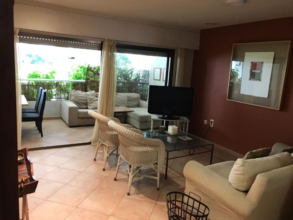 a living room with a couch and a table at Apartamento en 1ª LINEA Playa de Gandia in Gandía