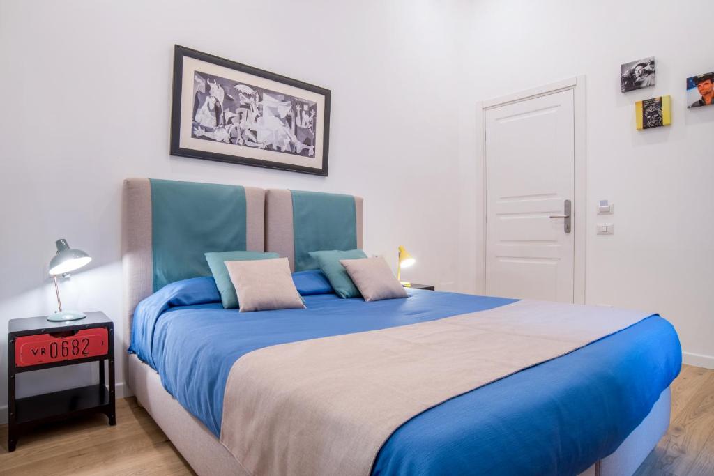 Postel nebo postele na pokoji v ubytování Napoliamo Guest House