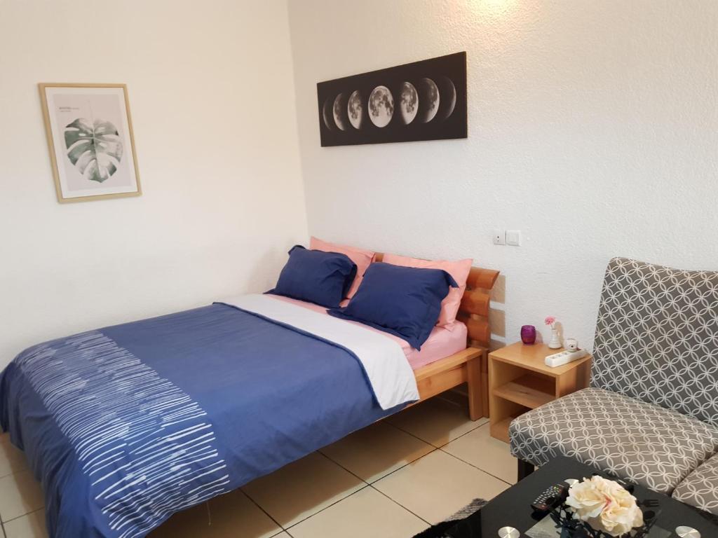 Postel nebo postele na pokoji v ubytování Residence Fatiny