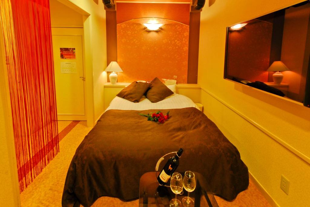 Postel nebo postele na pokoji v ubytování Hotel Joyseaside (Love Hotel)