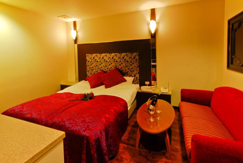 Postel nebo postele na pokoji v ubytování Hotel Joyseaside (Love Hotel)