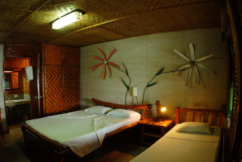 Postel nebo postele na pokoji v ubytování Costa Aguada Island Resort, Inampulugan Island, Sibunag, Guimaras