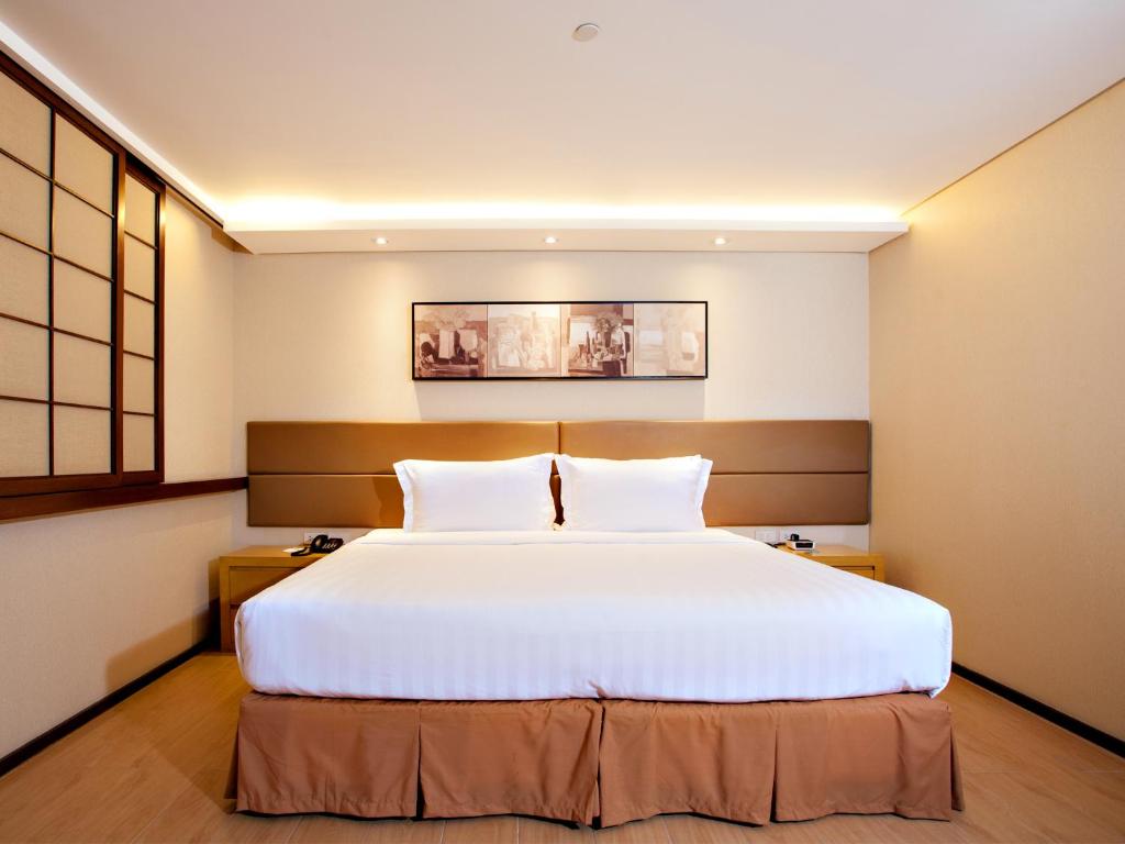 Postel nebo postele na pokoji v ubytování Jinjiang Inn - Makati
