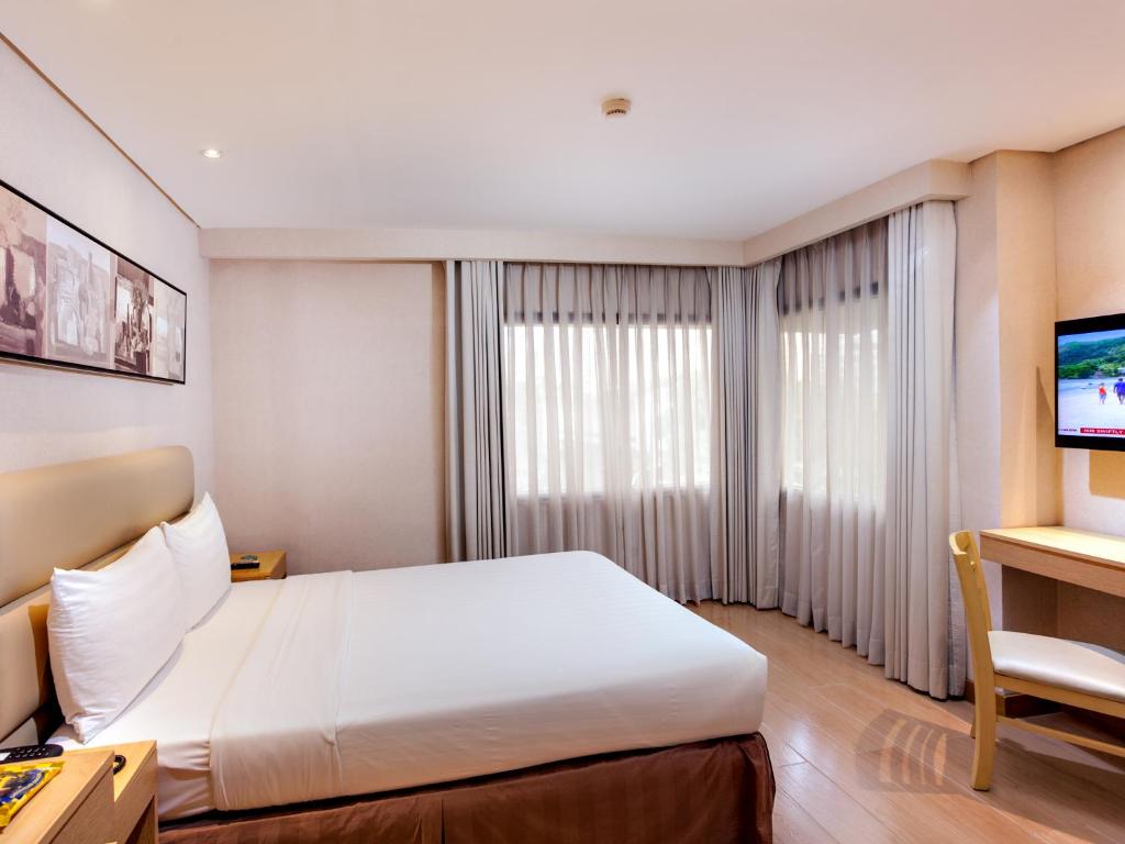 Postel nebo postele na pokoji v ubytování Jinjiang Inn - Ortigas