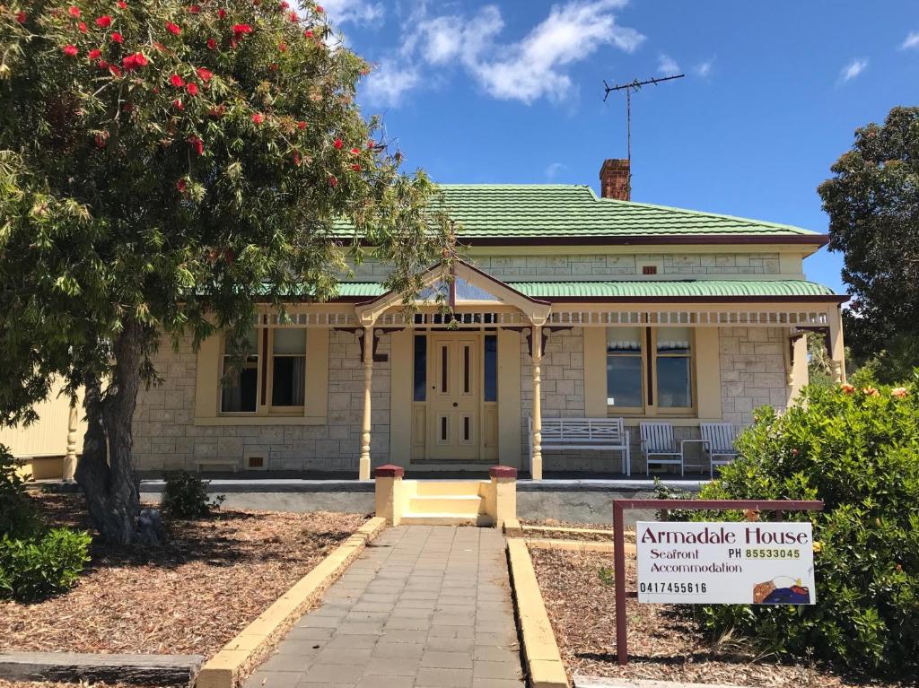 a house with a sign in front of it at Armadale House - Kingscote in Kingscote