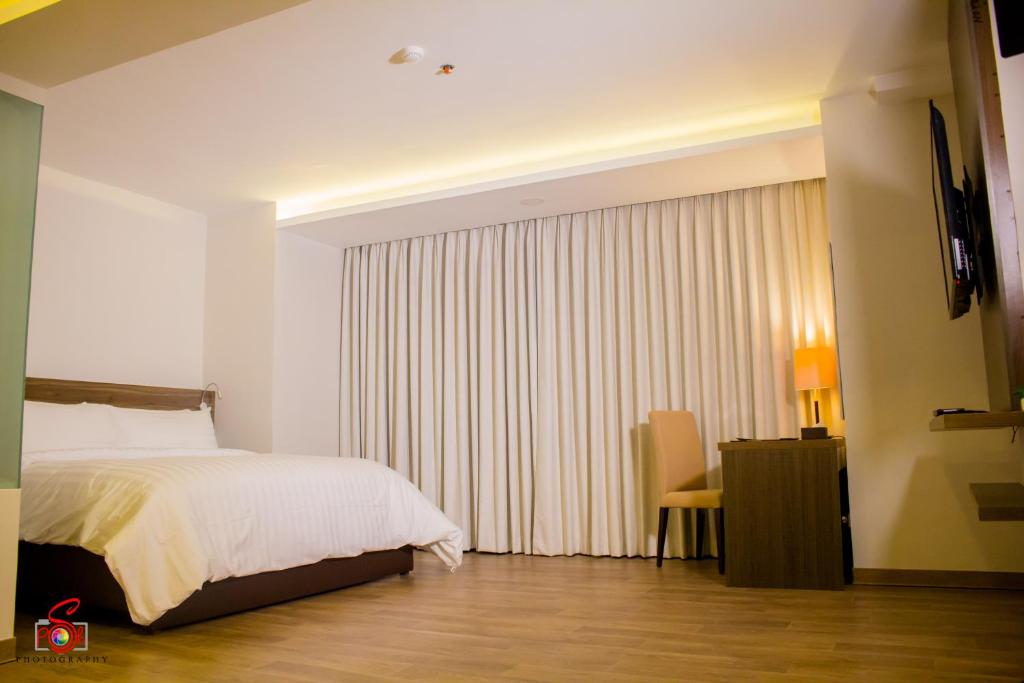 Postel nebo postele na pokoji v ubytování Hotel Marciano