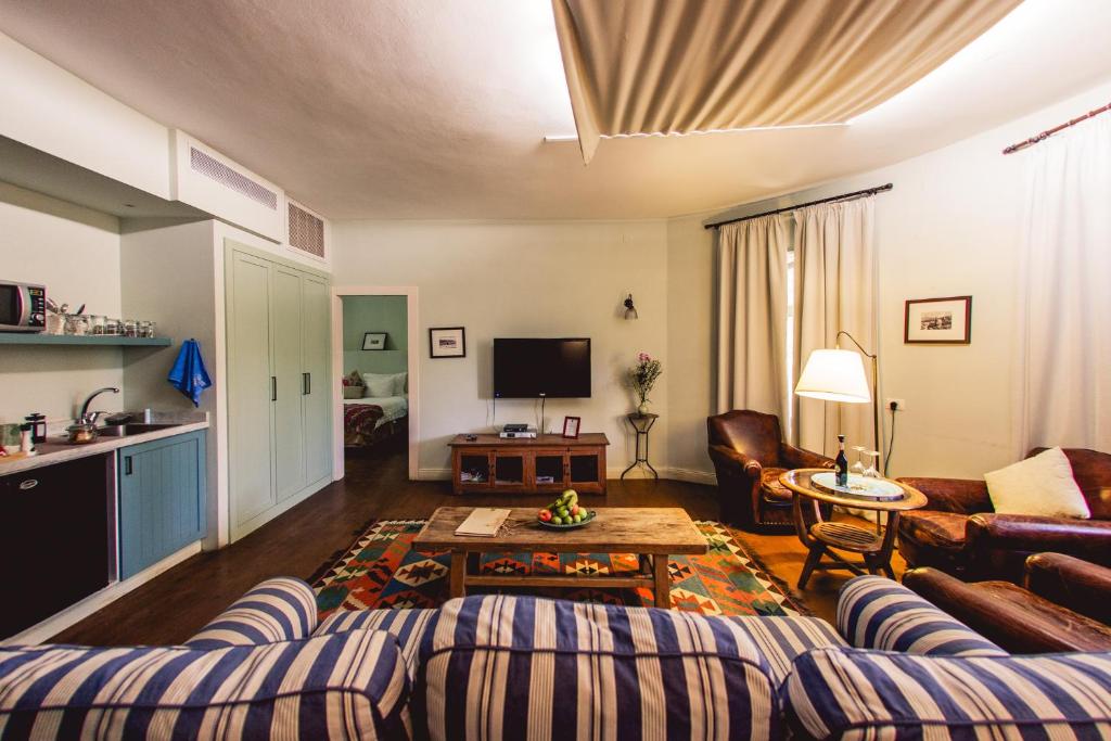 a living room with a couch and a table at Tur Sinai Organic Farm Resort in Jerusalem