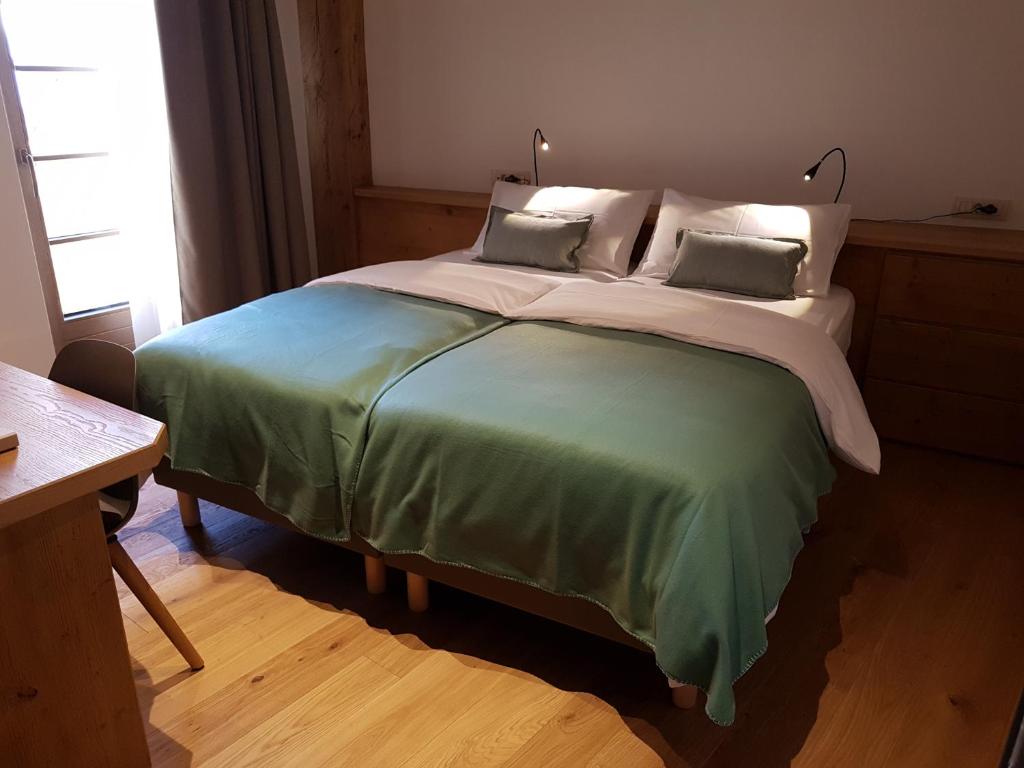 Postel nebo postele na pokoji v ubytování Hotel Vandot