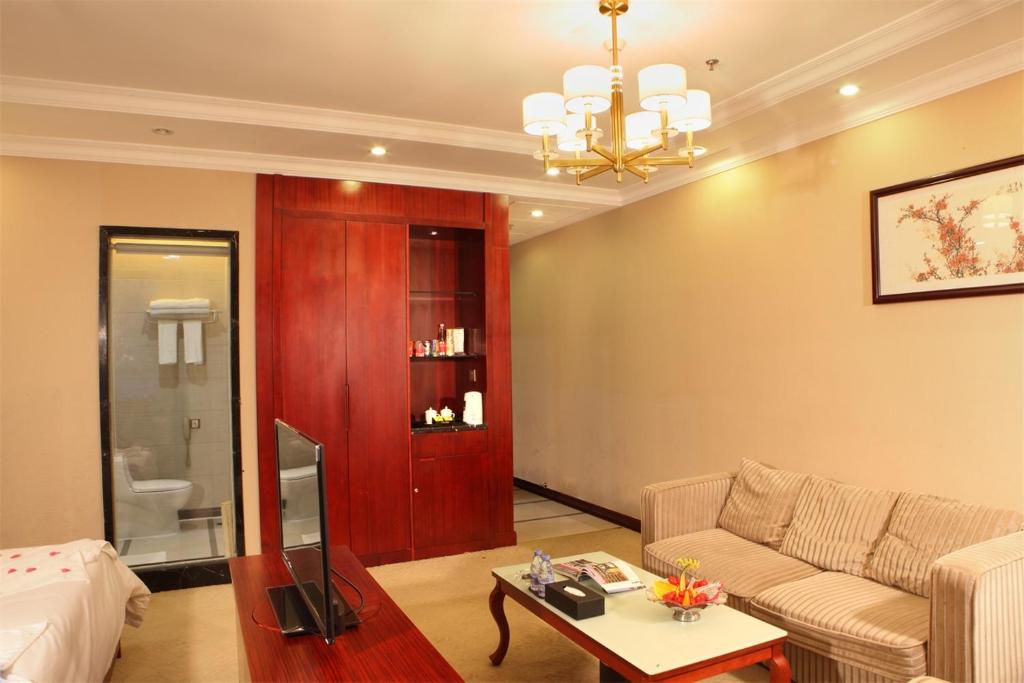 Postel nebo postele na pokoji v ubytování Guangzhou Shi Liu Hotel