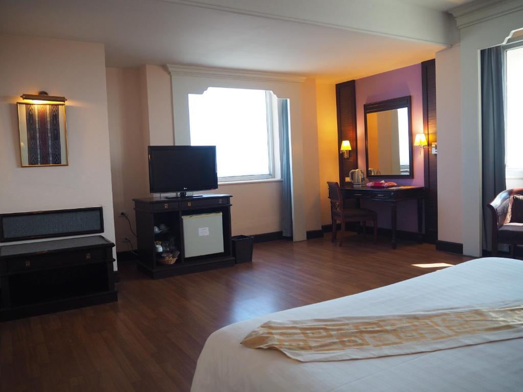 Postel nebo postele na pokoji v ubytování Charoen Thani Hotel, Khon Kaen