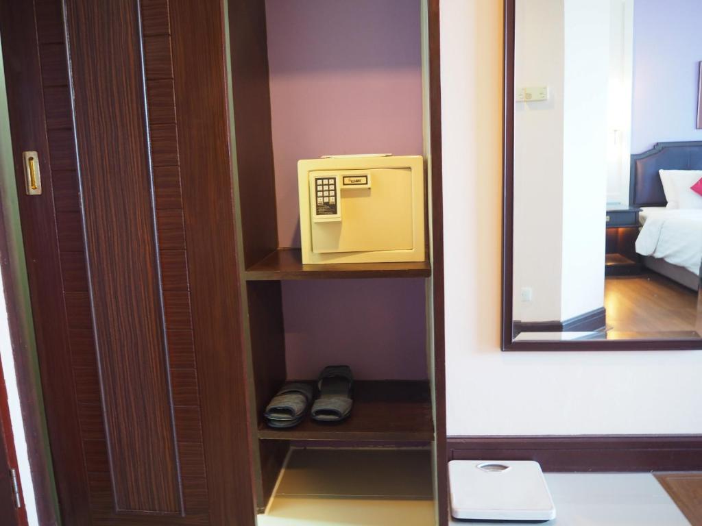 Postel nebo postele na pokoji v ubytování Charoen Thani Hotel, Khon Kaen