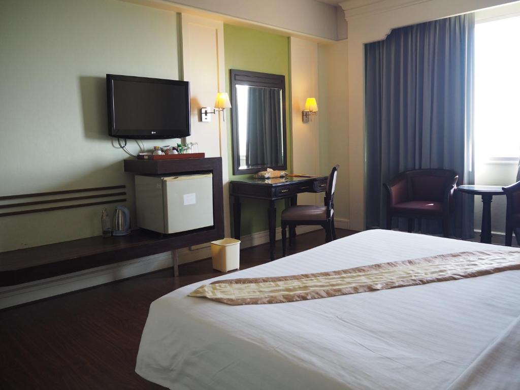 Postel nebo postele na pokoji v ubytování Charoen Thani Hotel, Khon Kaen