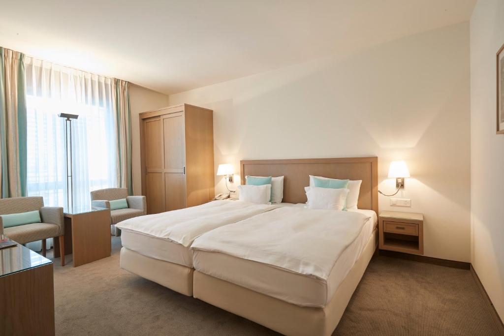Postel nebo postele na pokoji v ubytování Hotel Ascovilla Charming Hideway