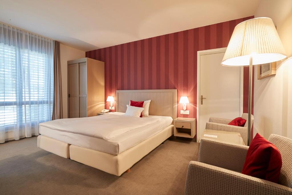 Postel nebo postele na pokoji v ubytování Hotel Ascovilla Charming Hideway