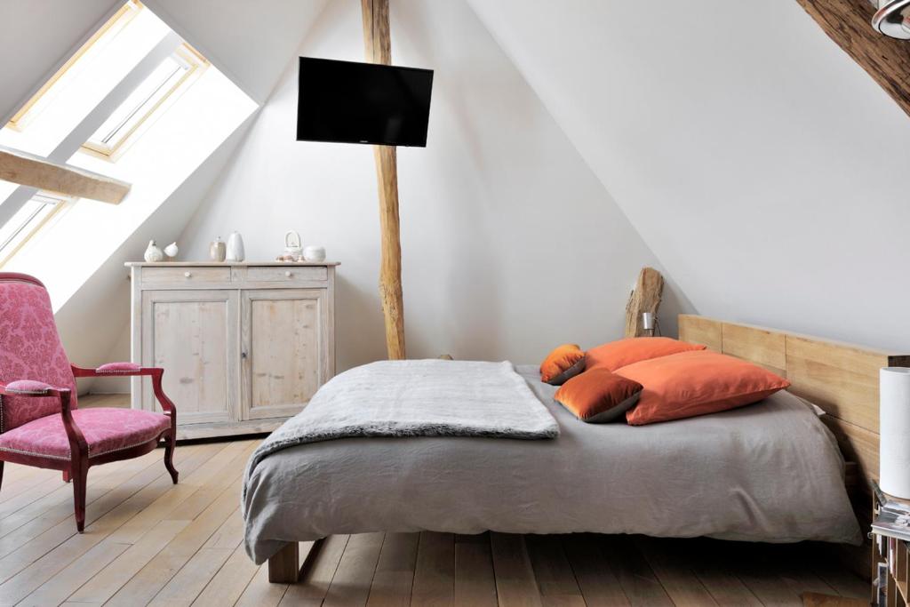 Ein Bett oder Betten in einem Zimmer der Unterkunft Un Loft a La Campagne