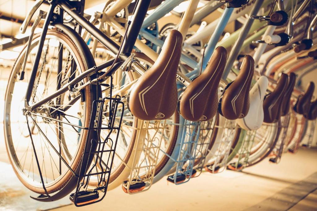 a group of bikes lined up in a rack at Residence Terminus in Rimini