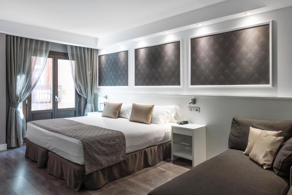 Cama o camas de una habitación en Catalonia Magdalenes
