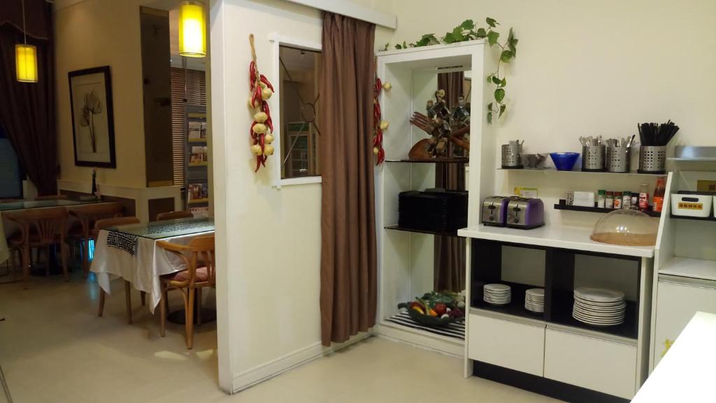 Kuchyň nebo kuchyňský kout v ubytování 苓雅大飯店 Lingyea Hotel