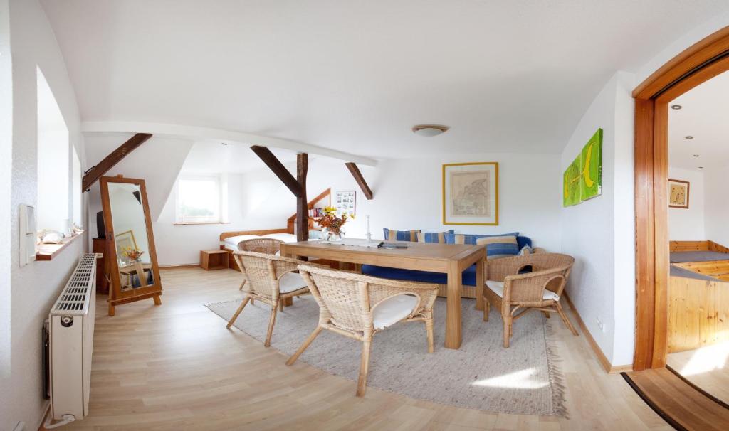 a dining room with a table and chairs at Morgensonne in Hiddensee