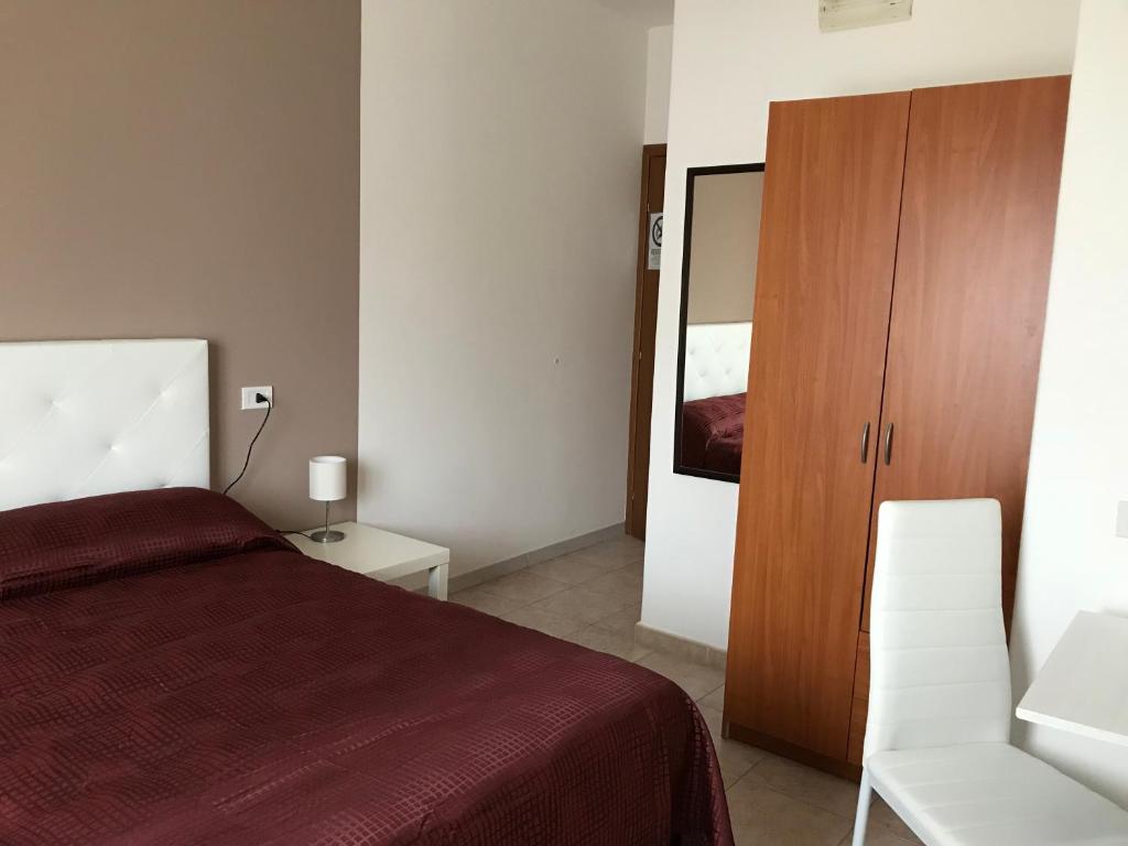 Postel nebo postele na pokoji v ubytování B&B New Triscele