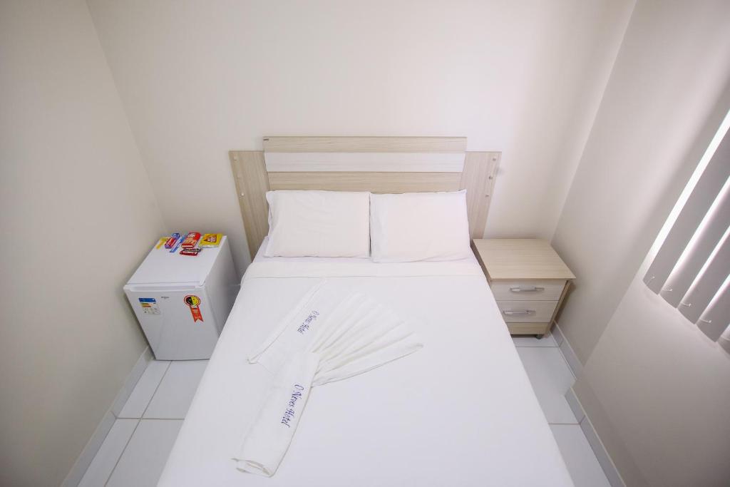 Postel nebo postele na pokoji v ubytování O Neves Hotel